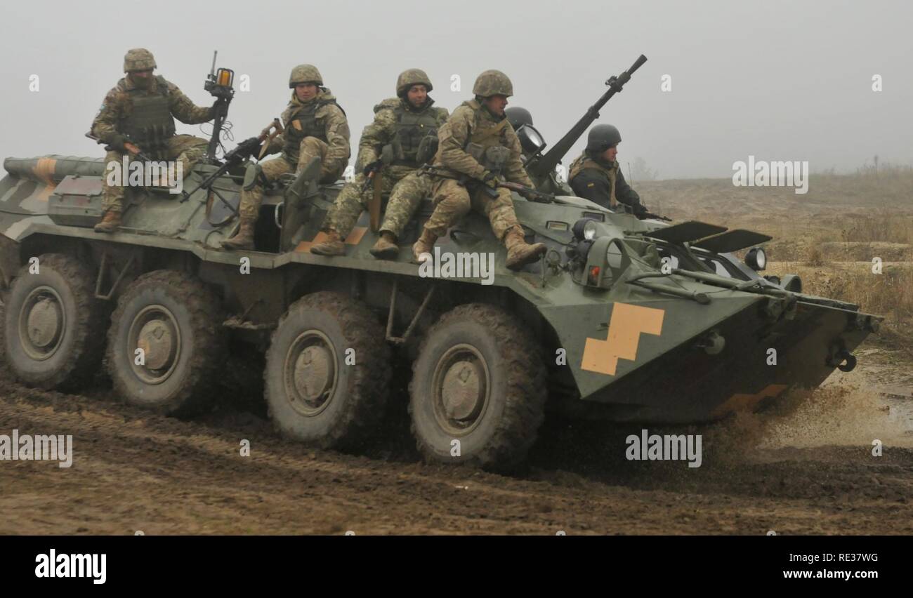 ukrainian-soldiers-assigned-to-1st-battalion-80th-airmobile-brigade-prepare-to-dismount-a-btr-armored-vehicle-during-a-live-fire-training-exercise-nov-12-at-the-international-peacekeeping-and-security-center-soldiers-assigned-to-6th-squadron-8th-cavalry-regiment-2nd-infantry-brigade-combat-team-3rd-infantry-division-is-deployed-in-support-of-the-joint-multinational-training-group-ukraine-jmtg-u-is-focused-on-direct-training-of-ukrainian-ground-forces-in-the-near-term-while-helping-to-build-an-enduring-and-sustainable-training-capacity-for-the-future-army-RE37WG.jpg