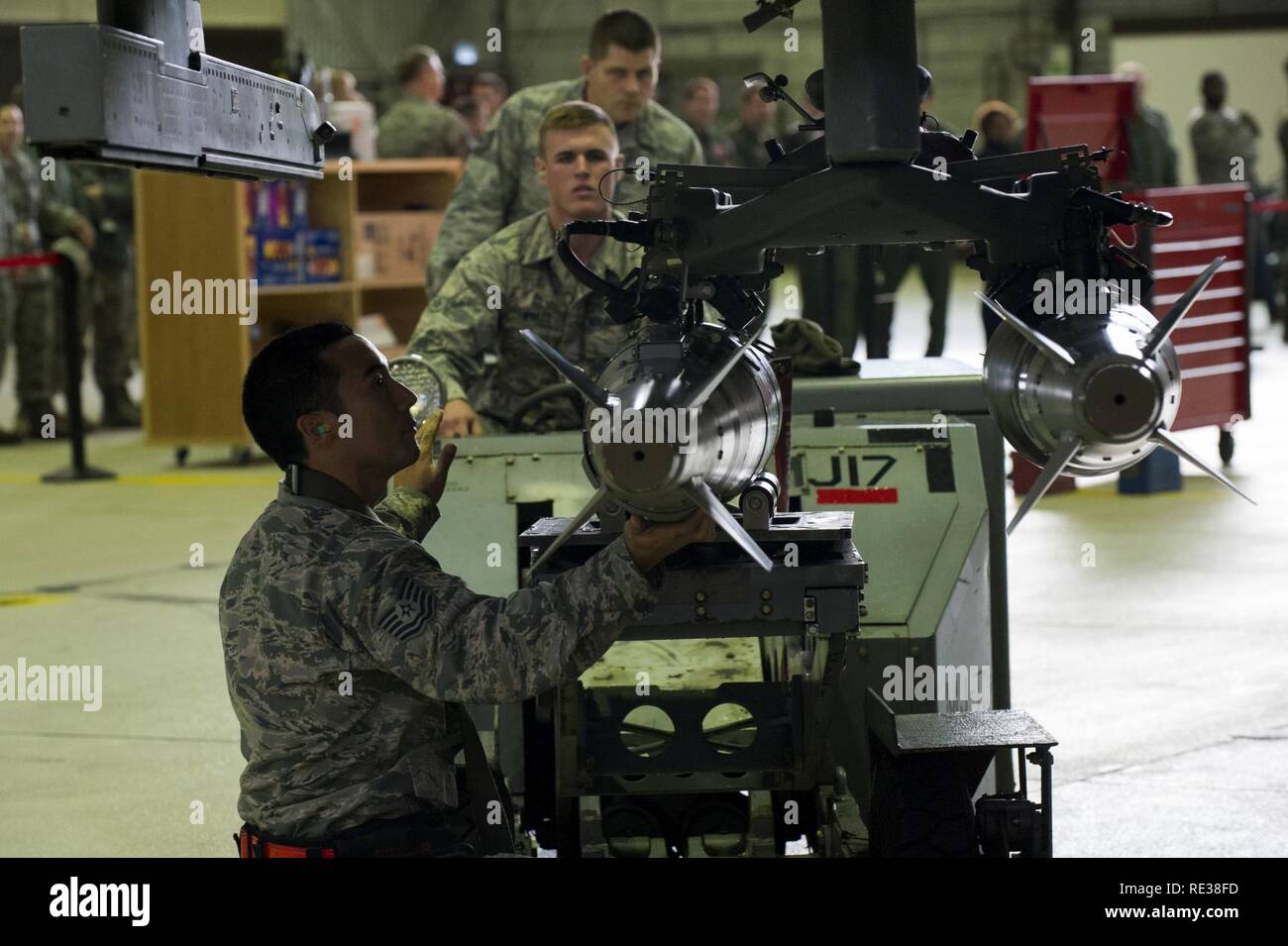 U.S. Air Force Airman 1st Class Austin Winker, center, 52nd Aircraft ...