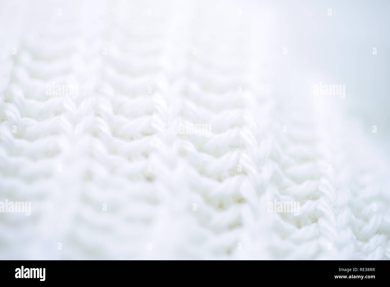 macro background white wool knitted textiles Stock Photo