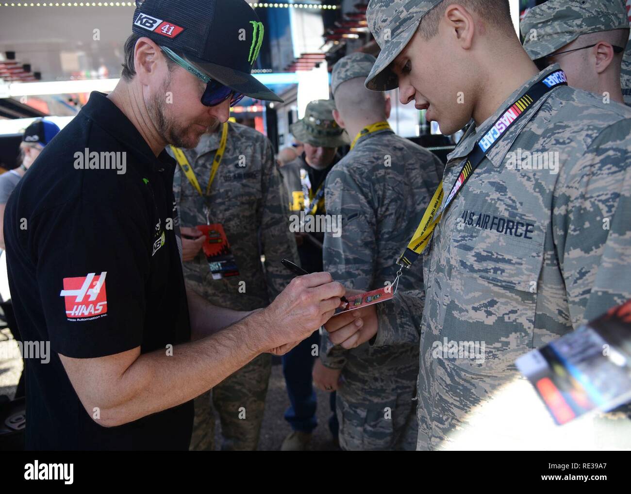 Kyle Busch, NASCAR driver, signs Airman Logan Mejia, 56th Equipment Maintenance Squadron