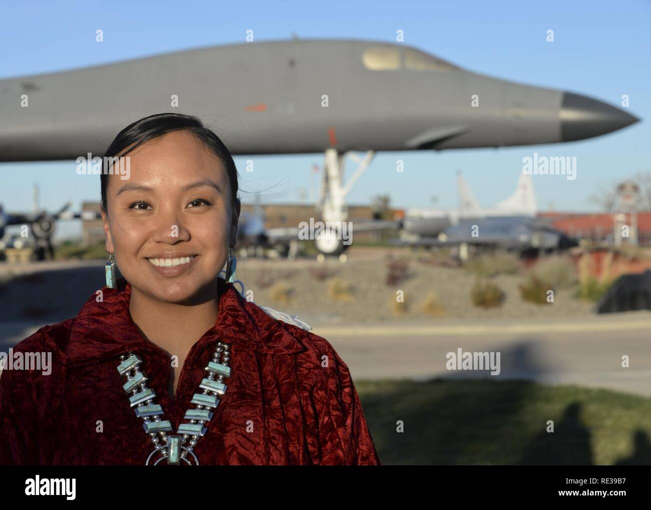 Staff Sgt. Anika Dexter, an individual protective equipment supervisor assigned to the 28th Logistics Readiness Squadron, poses for a photo in front of a B-1B Lancer at the South Dakota Air & Space Museum Nov. 10, 2016 at Ellsworth Air Force Base, S.D. Dexter, a Navajo Native American, is proud to honor her traditions and serve in the military defending her country, following in the same footsteps as her grandfathers. Stock Photo