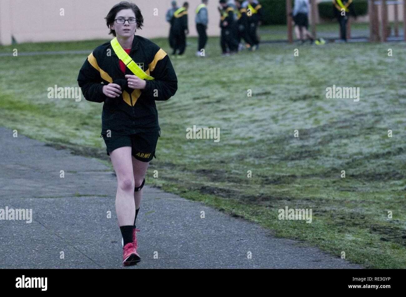 2nd Lt. Jenna Andry, 1st Battalion, 37th Field Artillery Regiment, 2nd Infantry Division Artillery, runs a lap in remembrance of retired Command Sgt. Maj. James “Jim” Steinthal on Rose Field, Joint Base Lewis-McChord, Wash., Nov. 18, 2016. The battalion held a two-week run-a-thon in honor of the late honorary regimental CSM. Stock Photo