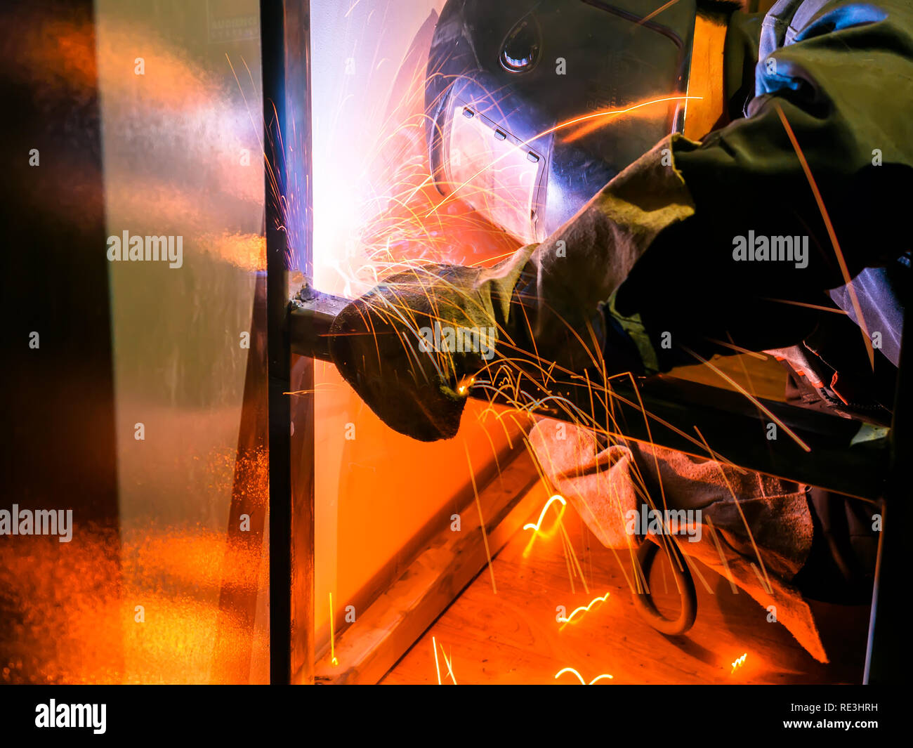 Welder Worker Performs Jump Welding. Worker Welder Performs ArcWelding