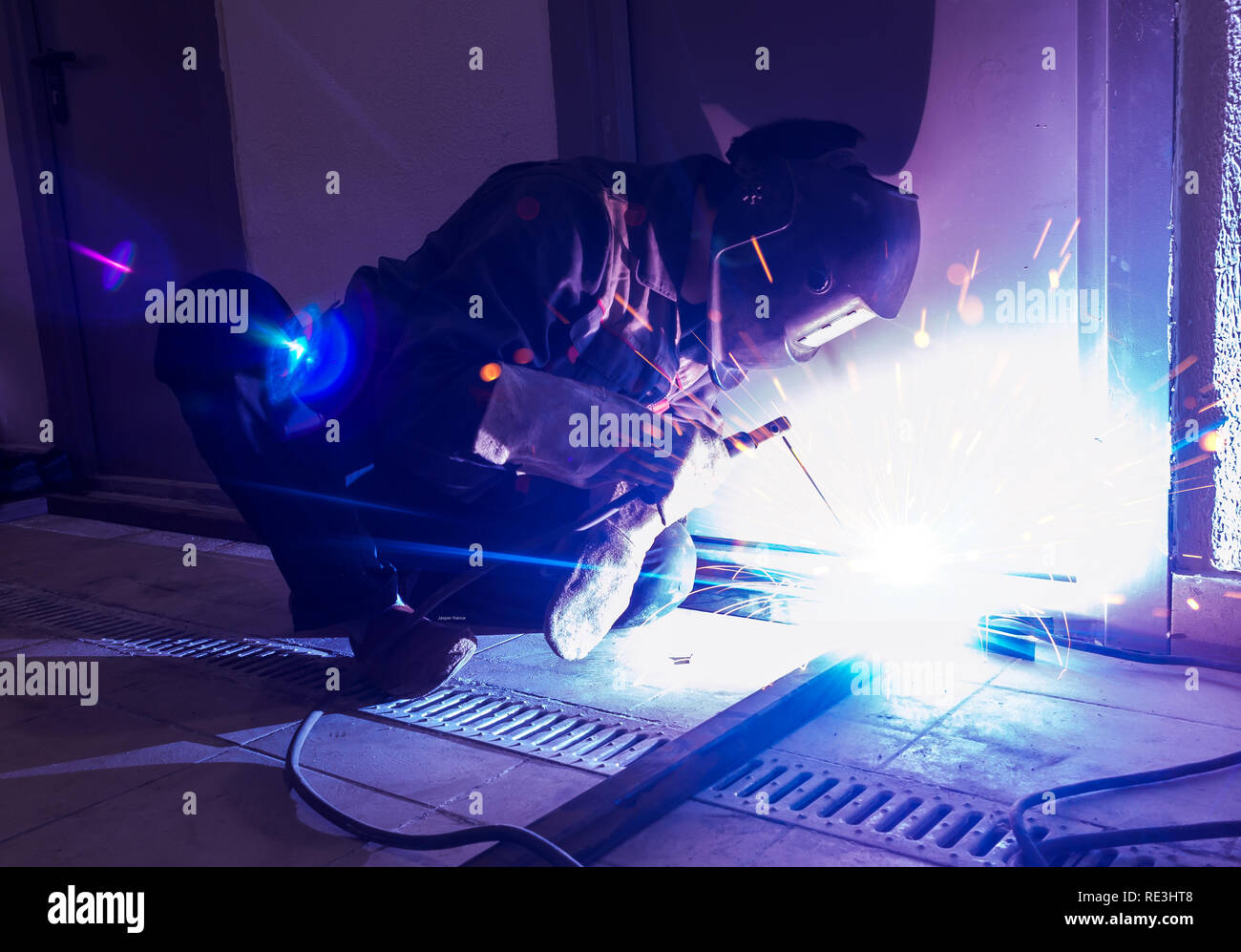 Welder Worker Performs Jump Welding. Worker Welder Performs ArcWelding