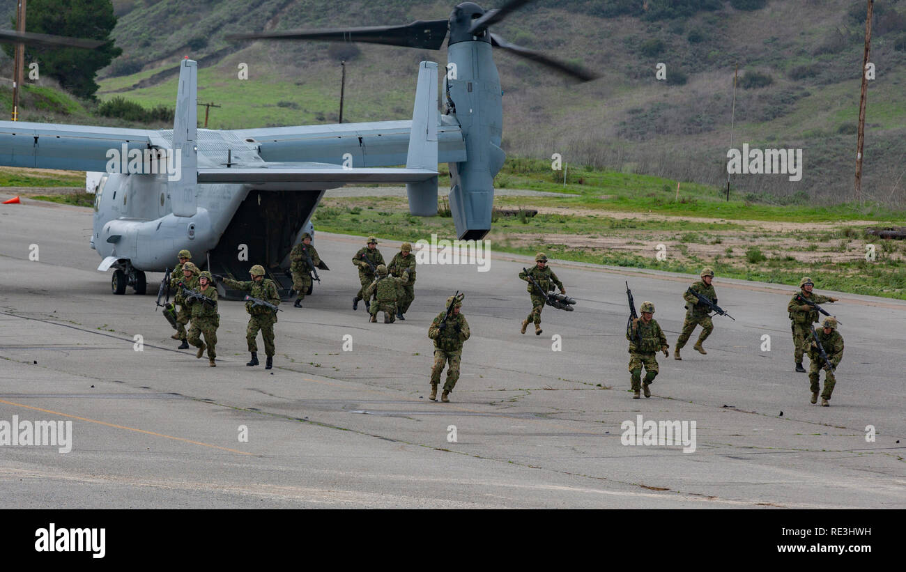 Japan Ground Self-Defense Force Soldiers with 1st Amphibious Rapid Development Regiment, exit an MV-22 Osprey tiltrotor aircraft and set up a security perimeter during Iron Fist Jan. 18, 2019 on U.S. Marine Corps Base Camp Pendleton, CA. Exercise Iron Fist is an annual, multilateral training exercise where U.S. and Japanese service members train together and share techniques, tactics and procedures to improve their combined operational capabilities. (U.S. Marine Corps photo by Cpl. Cutler Brice) Stock Photo