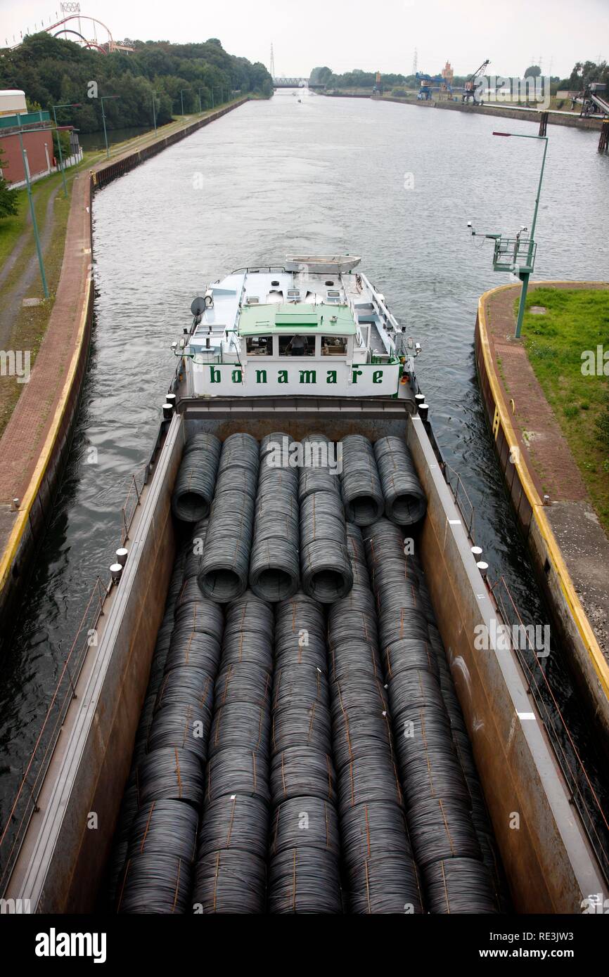 Cargo ship with steel wire coils on the Rhine-Herne Canal, Baukau lock, Herne, North Rhine-Westphalia Stock Photo