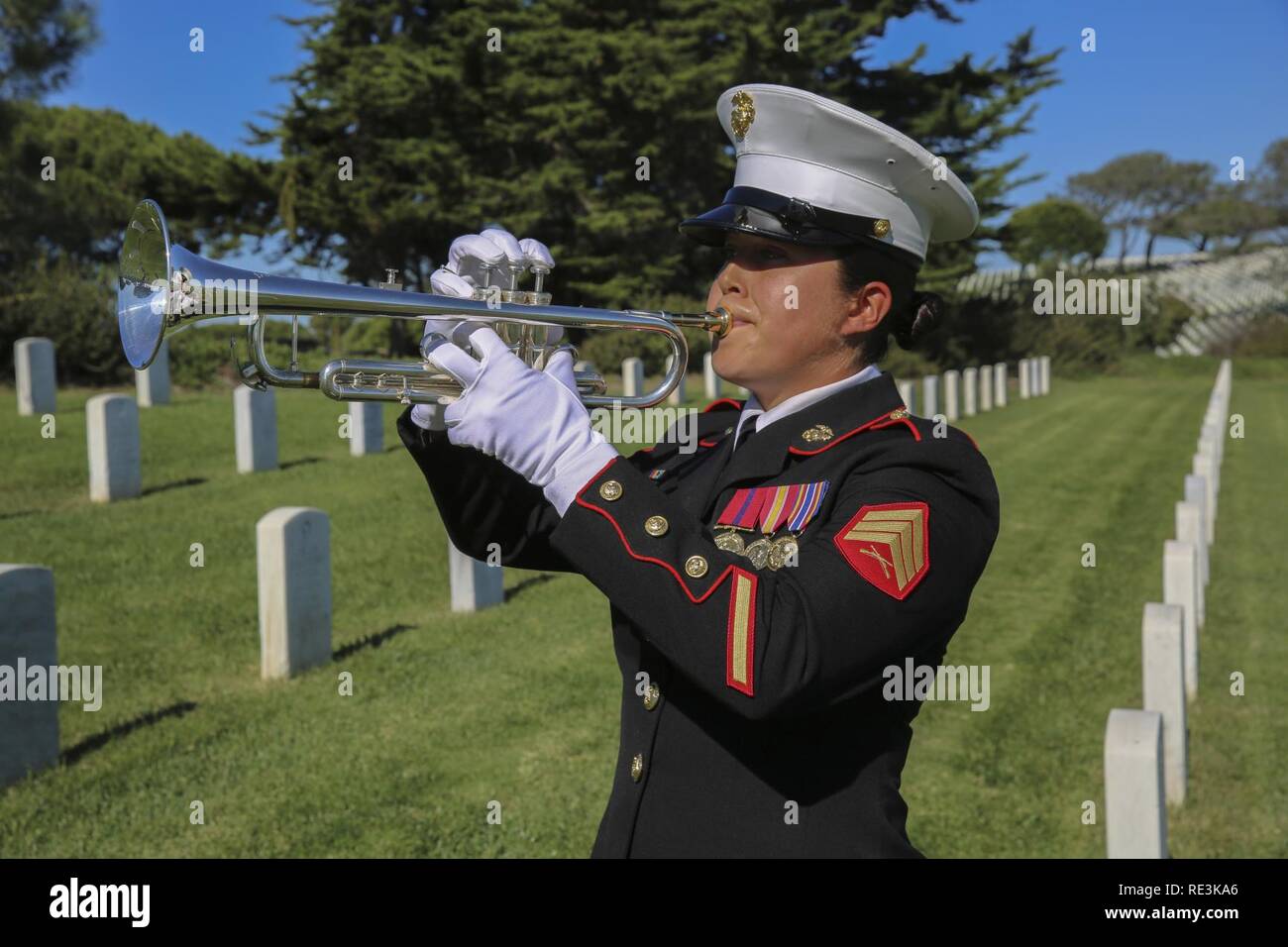 A Marine trumpet player from the Marine Corps Recruit Depot San Diego Band, plays taps during a
