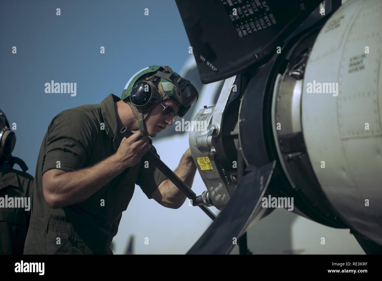 U.S. Navy Petty Officer 2nd Class Melvin Faust, Golden Swordsman Patrol Squadron (VP-47) aviation machinist’s mate, guides a propeller onto the turbine on a P-3 Orion Nov. 8, 2016, at Kadena Air Base, Japan. VP-47 is currently deployed to Kadena Air Base in support of the U.S. Pacific Fleet. Stock Photo