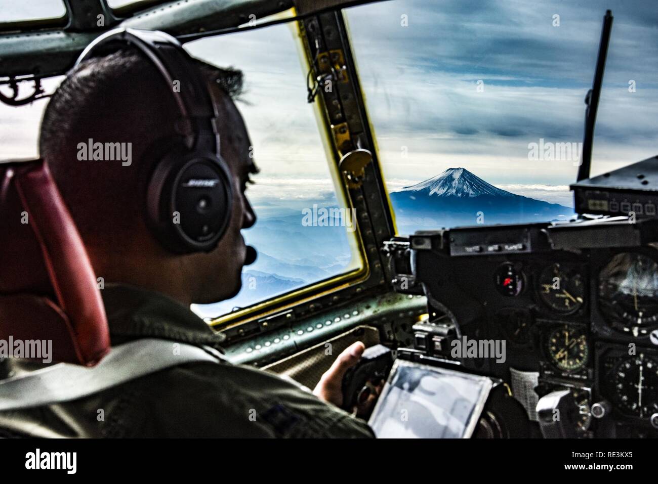 36th Airlift Squadron C-130H pilot looks at Mt. Fuji during Keen Sword 2017 on Nov. 10, 2016, near Mt. Fuji, Japan. Originating in 1986, Keen Sword has been a routine military training exercise between the U.S. and Japan. Stock Photo