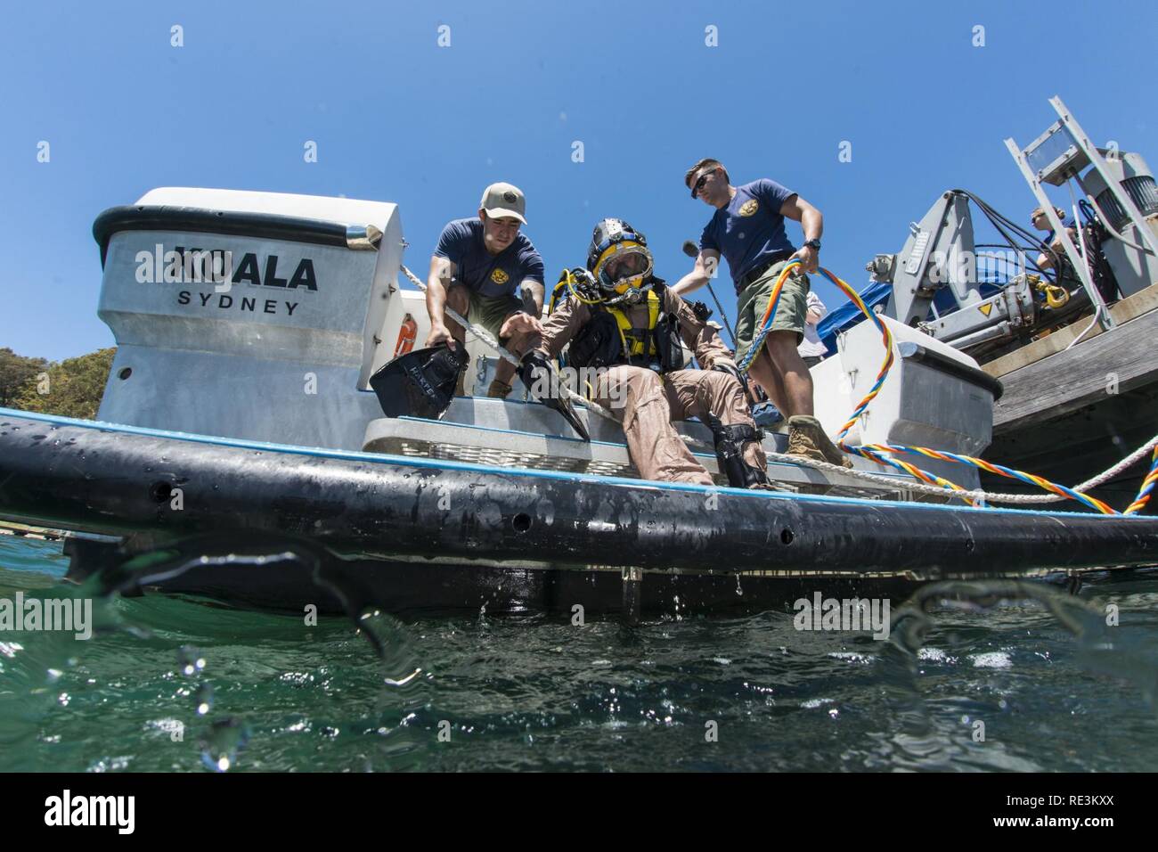 Navy Divers assigned to Mobile Diving Salvage Unit (MDSU) 1 prepare for underwater salvage