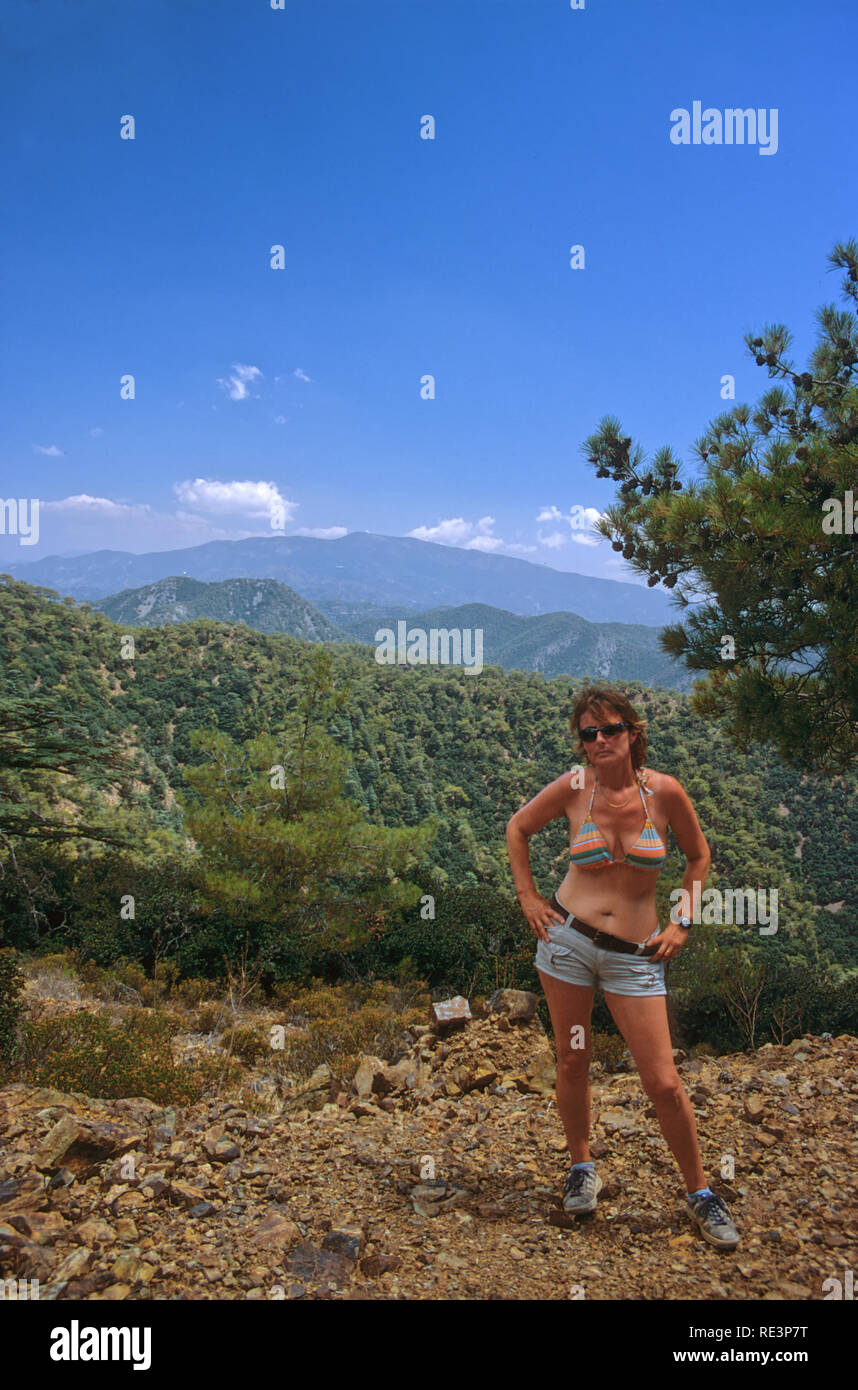 Female hiker, wearing a bikini top, Cedar Valley, Tillyria, Cyprus. MODEL  RELEASED Stock Photo - Alamy