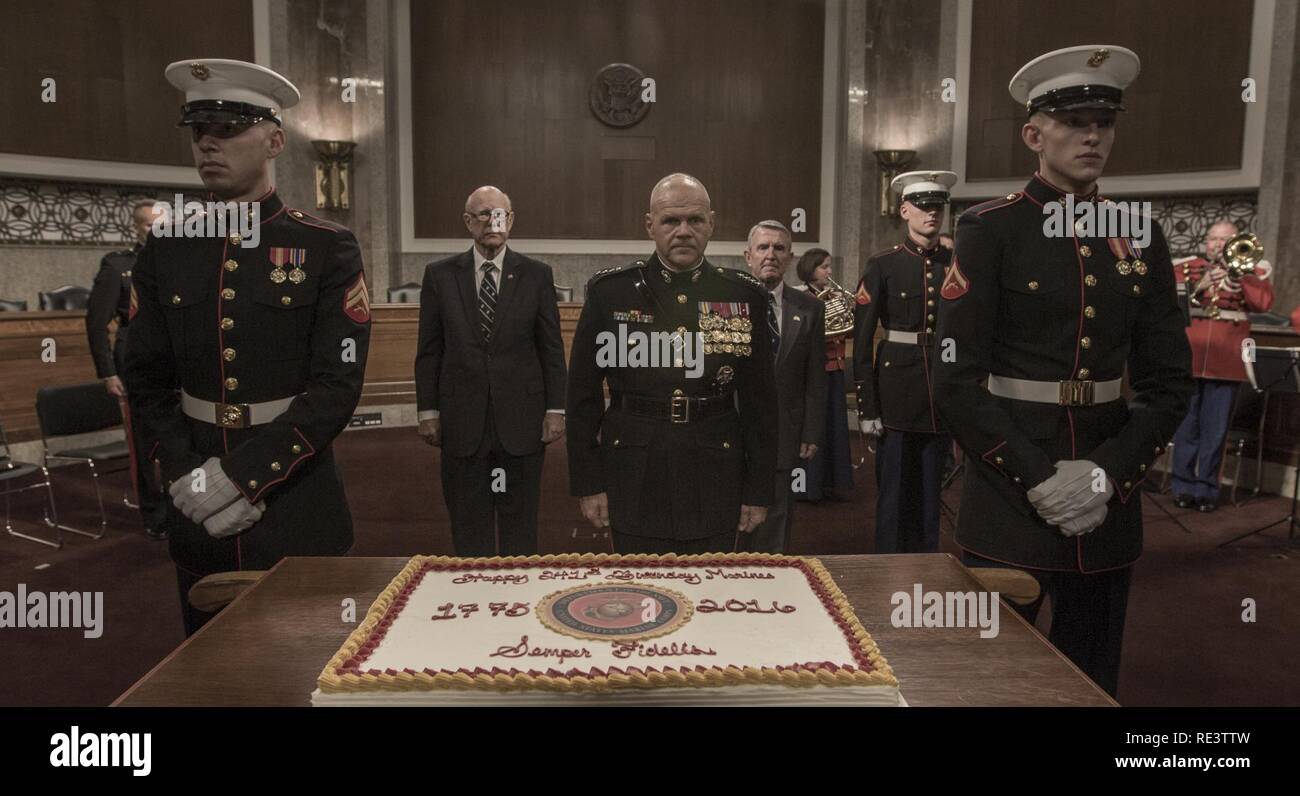 Senators Cake Commandant of the Marine Corps Gen. Robert B. Neller stands at the ...