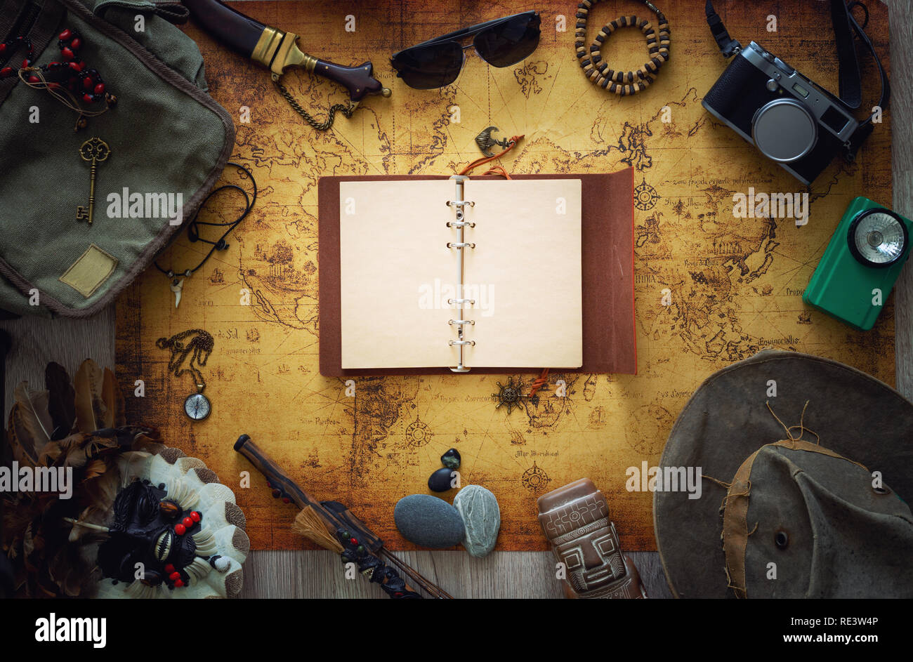 Old map, vintage travel equipment and souvenirs from the travel around the world / place for text Stock Photo