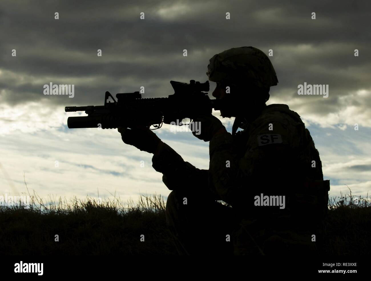 Senior Airman Brandon Thompson, 791st Missile Security Forces Squadron defender, provides security during a recapture and recovery exercise at the missile complex, N.D., Nov. 16, 2016. During the scenario, simulated hostile forces took control of a payload transporter and the defenders responded and recovered the asset. Stock Photo