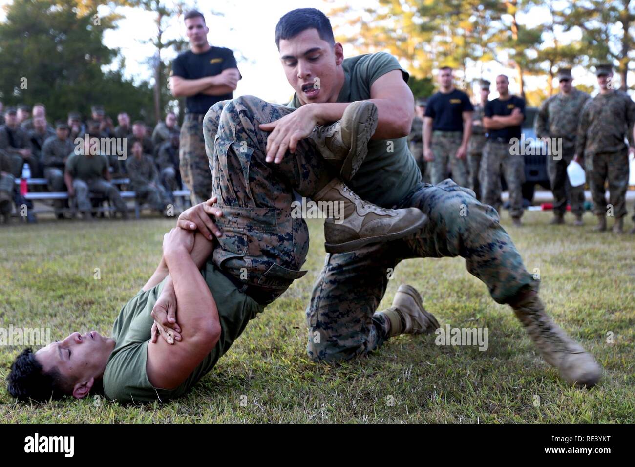 Corporal Cristian Caizabuestan (left) performs an armbar technique in