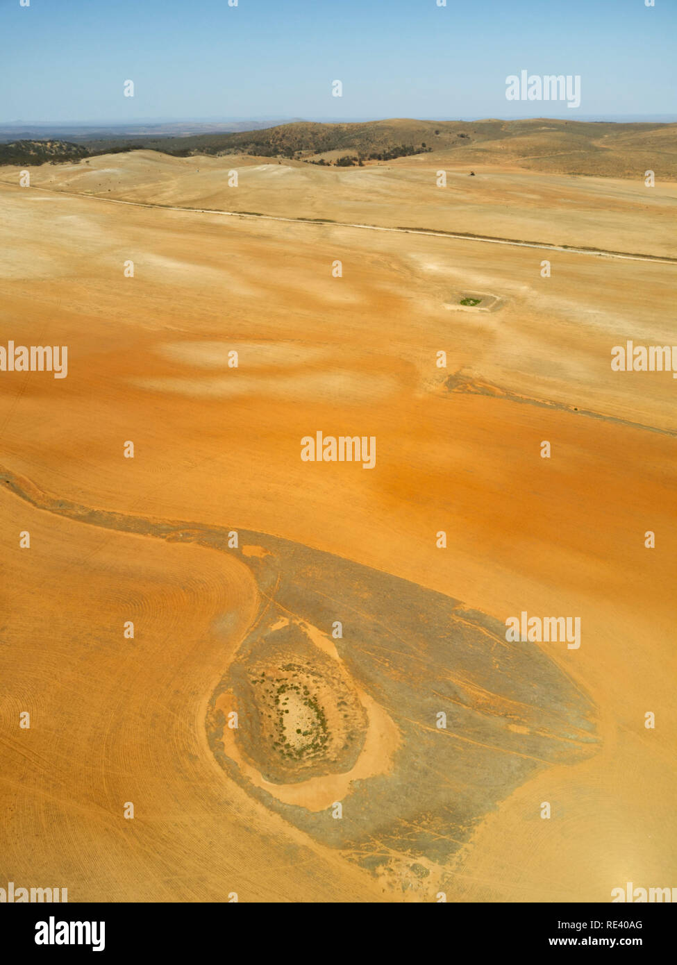 An earth dam sits empty after a prolonged drought near Mount Bryan East South Australia Stock Photo