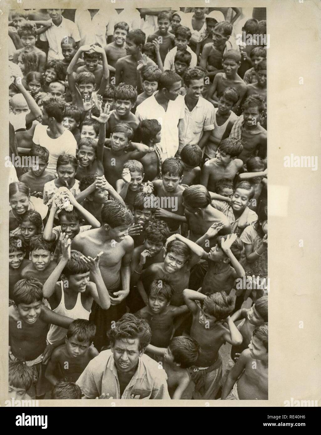 A LARGE GROUP OF CHILDREN. ON BACK OF IMG READS; BANGLADESH NAME 16824 ...