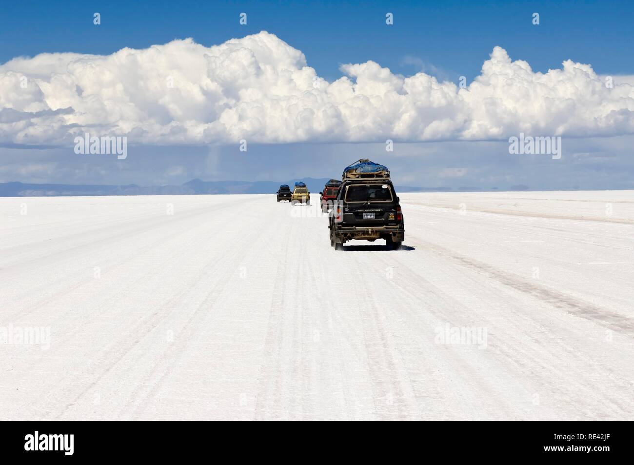 Four wheel drive cars on the Salar de Uyuni, Potosi, Bolivia, South America Stock Photo