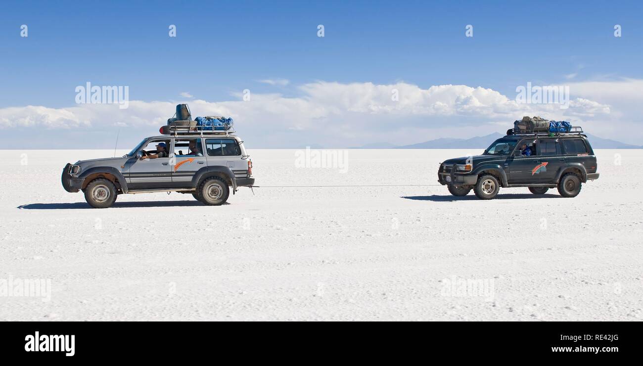 Four wheel drive cars on the Salar de Uyuni, Potosi, Bolivia, South America Stock Photo