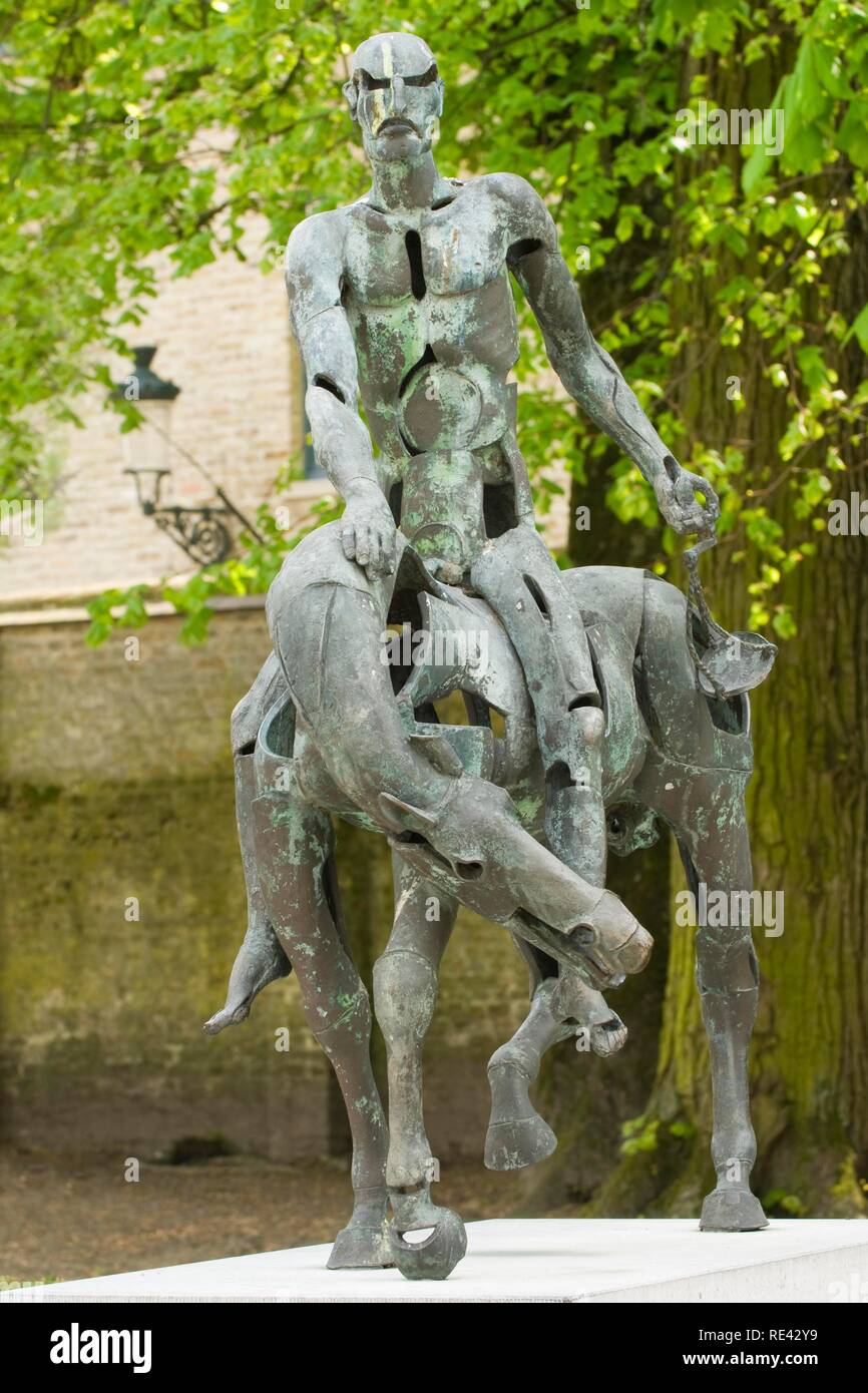 One of the Four Horsemen of the Apocalypse, bronze sculpture by Rik Poot, historic centre of Bruges, Unesco World Heritage Site Stock Photo