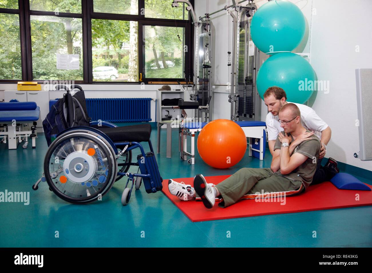 Mobilisation exercises for encouraging movement, muscle training and coordination exercises for a patient, physiotherapy, Stock Photo