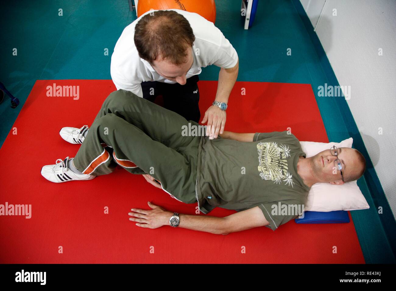 Physiotherapy exercises, mobilisation exercises for encouraging movement, physiotherapy in a neurological rehabilitation centre Stock Photo