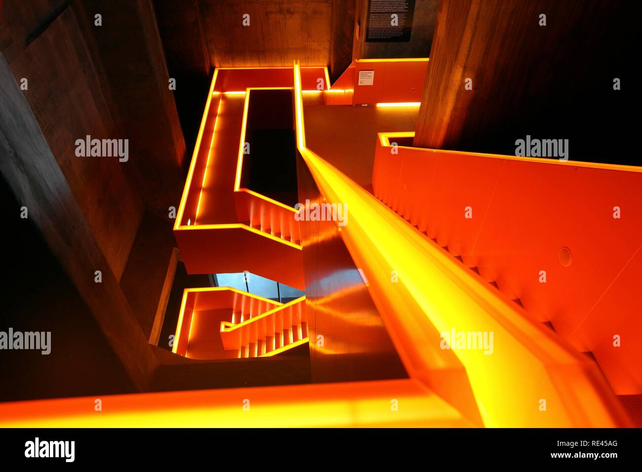 Red illuminated main staircase in the new Ruhrmuseum museum, opened in January 2010, Capital of Culture year, in the former coal Stock Photo