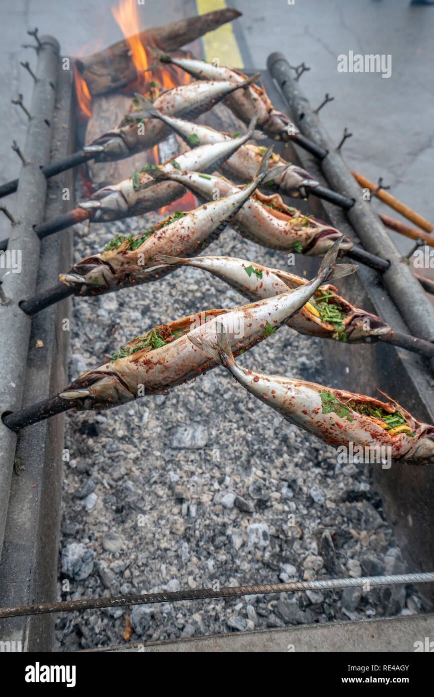 mackerel, cooking on the grill, city holiday Stock Photo Alamy