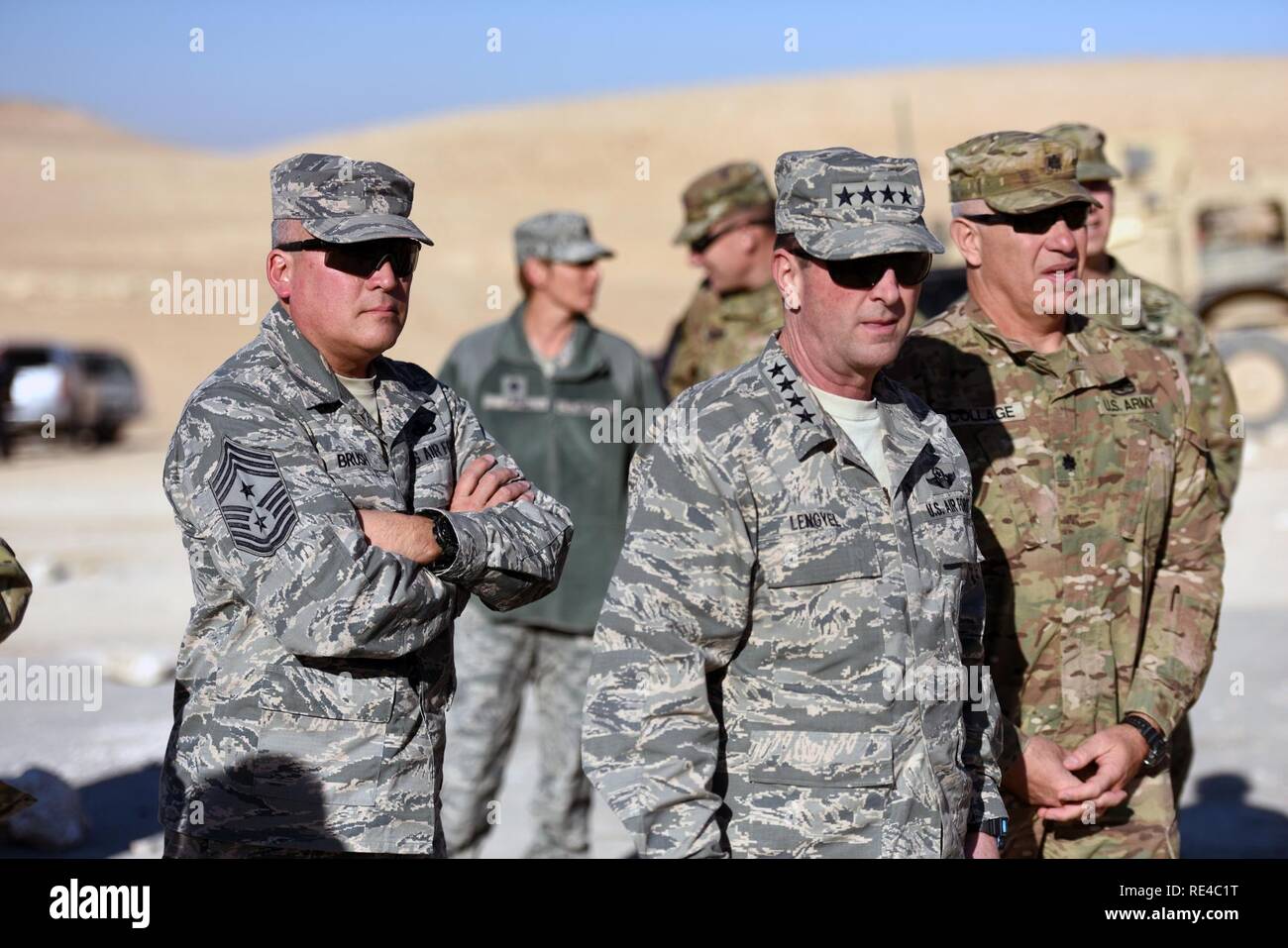 Air Force Gen. Joseph Lengyel, chief, National Guard Bureau, second from right, and Air Force Chief Master Sgt. Mitchell Brush, senior enlisted advisor to the chief of the National Guard Bureau, left, view training in the Hashemite Kingdom of Jordan during a Thanksgiving visit to troops, Nov. 26, 2016. Stock Photo