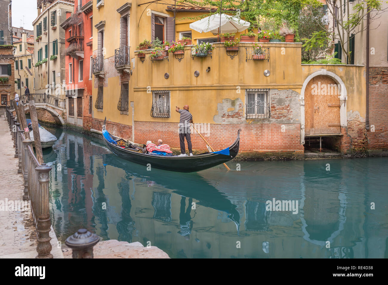 gondolier and Canal in Venice Stock Photo