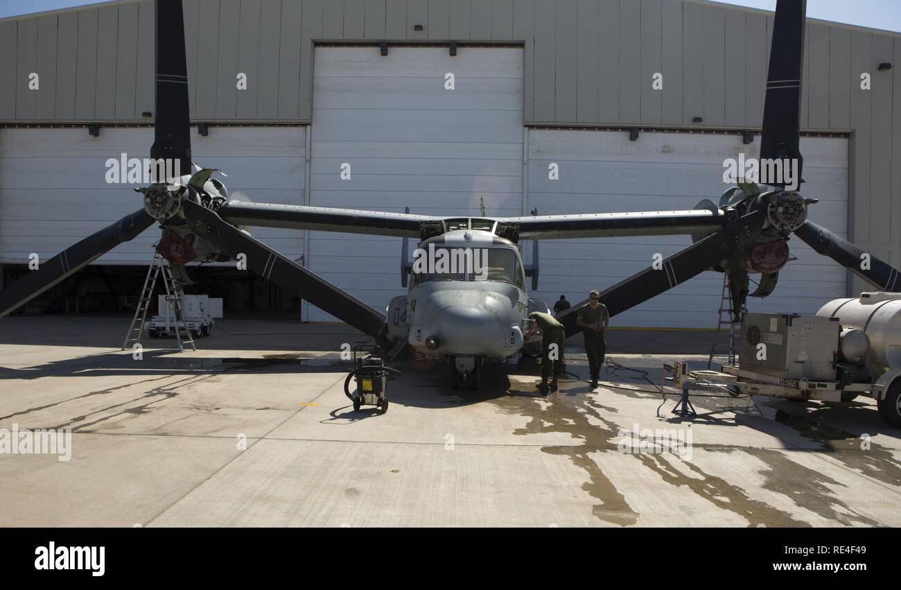 U.S. Marines with the Special Purpose Marine Air Ground Task Force-Crisis Response-Africa Air Combat Element conduct wash-down maintenance on a MV-22 Osprey at Camp Lemonnier, Djibouti, Africa, Nov. 7, 2016. The Marines conducted the wash down maintenance as part of a 91-day inspection before relief in place with 4th Marine Air Wing.  U.S. Marines and Sailors assigned to Special Purpose Marine Air-Ground Task Force-Crisis Response-Africa Command support operations, contingencies and security cooperation in the U.S. Africa Command area of responsibility. Stock Photo