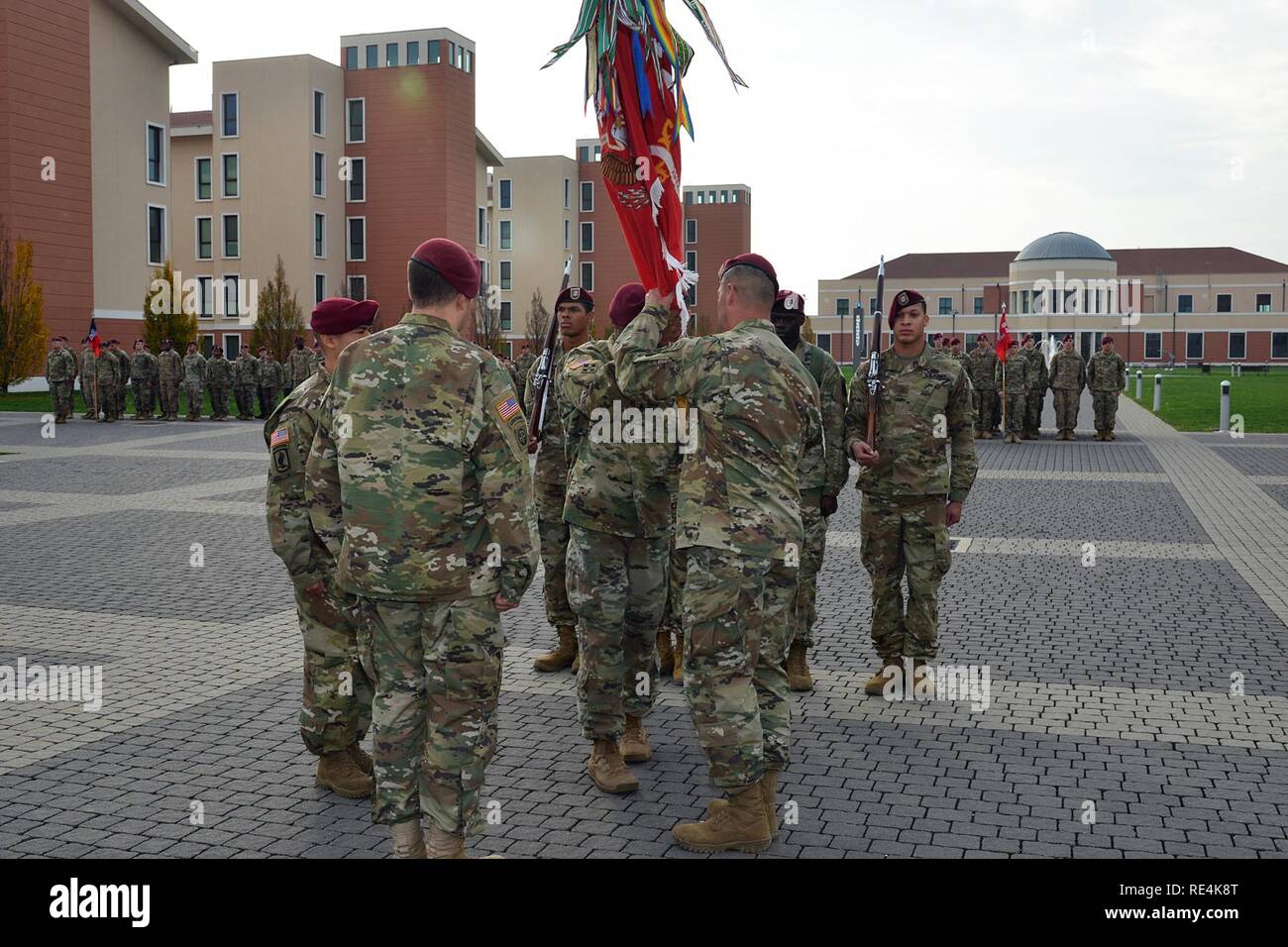 Sgt. 1st Class Marquis Walker, center, passes the flag to Command Sgt. Maj. Travis C. Crow, right, outgoing command, during a change of responsibility ceremony for 54th Brigade Engineer Battalion at  Caserma Del Din in Vicenza, Italy, Nov. 23, 2016.  The 173rd Airborne Brigade based in Vicenza, Italy, is the Army Contingency Response Force in Europe, and is capable of projecting forces to conduct the full of range of military operations across the United State European, Central and Africa Commands areas of responsibility. Stock Photo