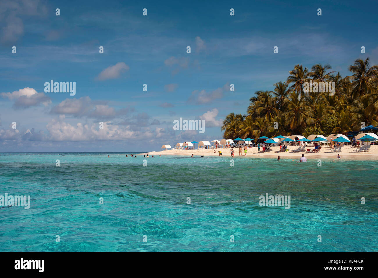 Tropical travel destination with tourists enjoying the turquoise water and white sand. Johnny Cay, San Andrés island, Colombia. Oct 2018 Stock Photo