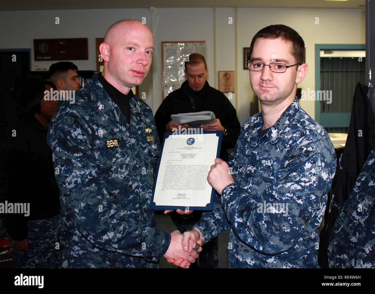2 MISAWA, Japan (Nov. 30, 2016) Petty Officer 1st Class Marshall Folsom,  attached to Naval Computer and Telecommunications Station Far East  Detachment Misawa (NCTSFE), from Kent, Wash., receives a Navy and Marine