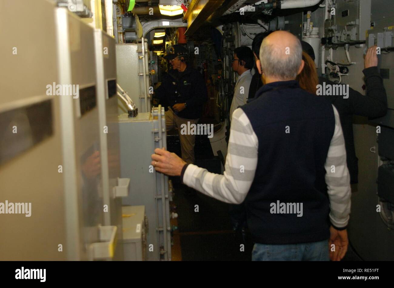 The first guided engine room tour aboard the USS Wisconsin (BB 64) of 2019. This below deck tour is offered through Nauticus, and takes visitors through compartments and engineering spaces that are generally closed to the public. The Wisconsin is an Iowa-Class Battleship that is moored permanently next to the Hampton Roads Naval Museum and Nauticus in Downtown Norfolk, Virginia as a museum ship. The Wisconsin is a popular venue for military ceremonies throughout the year, and is available through the Naval Museum to area commands without cost for this purpose. Stock Photo