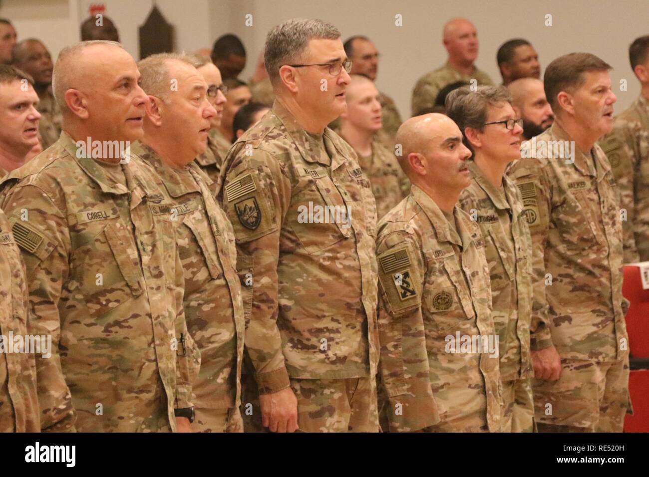 Soldiers sing the Army song during the transfer of authority ceremony between 143d Sustainment Command and 184th Sustainment Command at Camp Arifjan, Kuwait, Jan 2, 2019. Stock Photo