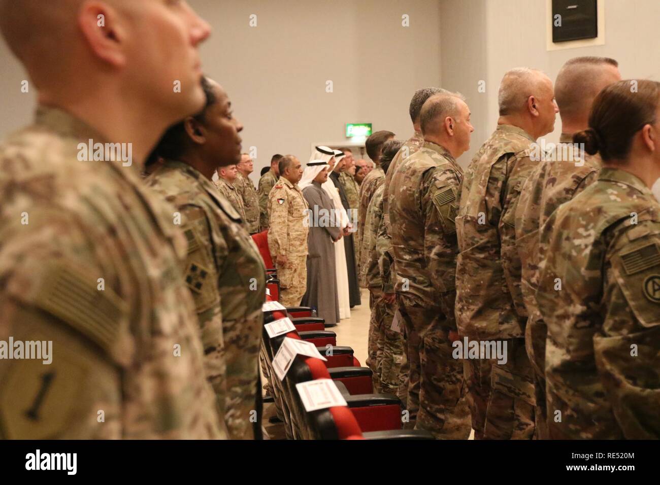 Soldiers stand during the transfer of authority ceremony between 143d Sustainment Command and 184th Sustainment Command at Camp Arifjan, Kuwait, Jan 2, 2019. Stock Photo