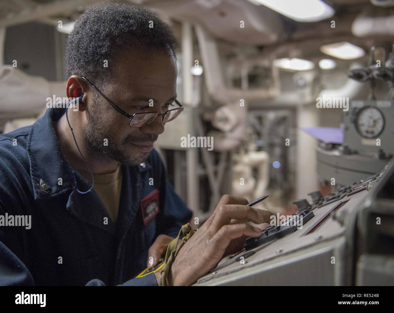 EAST CHINA SEA (Jan. 1, 2018) Gas Turbine System Technician (Mechanical) 3rd Class Jonathan Pate, from Eagan, Min., takes readings from a low pressure system aboard the Arleigh Burke-class guided-missile destroyer USS McCampbell (DDG 85). McCampbell is forward-deployed to the U.S. 7th Fleet area of operations in support of security and stability in the Indo-Pacific region. Stock Photo
