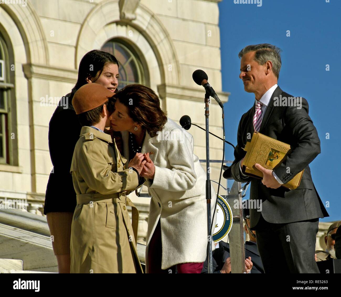Rhode Island's 75th Governor, the Honorable Gina Raimondo, accompanied by her husband and children, is sworn in by Secretary Nellie Gorbea at an inauguration ceremony held on the State House lawn in Providence, Rhode Island, January 1, 2019. U.S. Air National Guard Stock Photo
