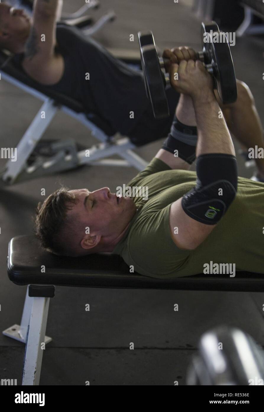 U.S. Marines Corps Lance Cpl. Kaden Cox, water support technician, 7th Engineer Support Battalion, Combat Logistics Regiment 1, 1st Marine Logistics Group, conducts an individual work out at Paige Fieldhouse, Marine Corps Base Camp Pendleton, California, Jan. 2, 2019. All Marines are required to undergo unit physical fitness training daily, but they are also highly encouraged to train on their own in order to achieve optimal physical fitness. Stock Photo