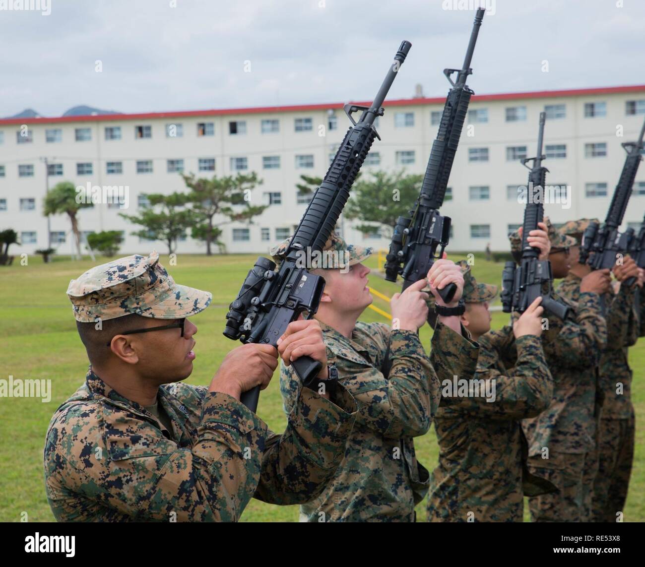 Marines with the 31st Marine Expeditionary Unit perform “inspection arms” during practice for the Commanding General’s Readiness Inspection at Camp Hansen, Okinawa, Japan, Jan. 3, 2019. The CGRI is a regular requirement for units to ensure mission readiness. The 31st MEU, the Marine Corps’ only continuously forward-deployed MEU, provides a flexible force ready to perform a wide range of military operations as the premier crisis response force in the Indo-Pacific region. Stock Photo