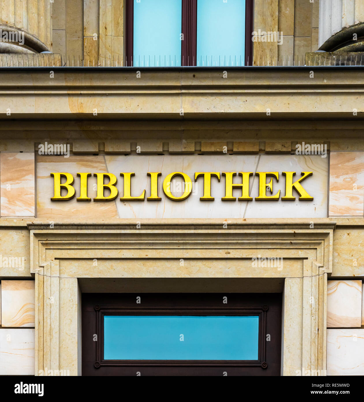 Entrance of a library in an ancient building labelled with golden ...