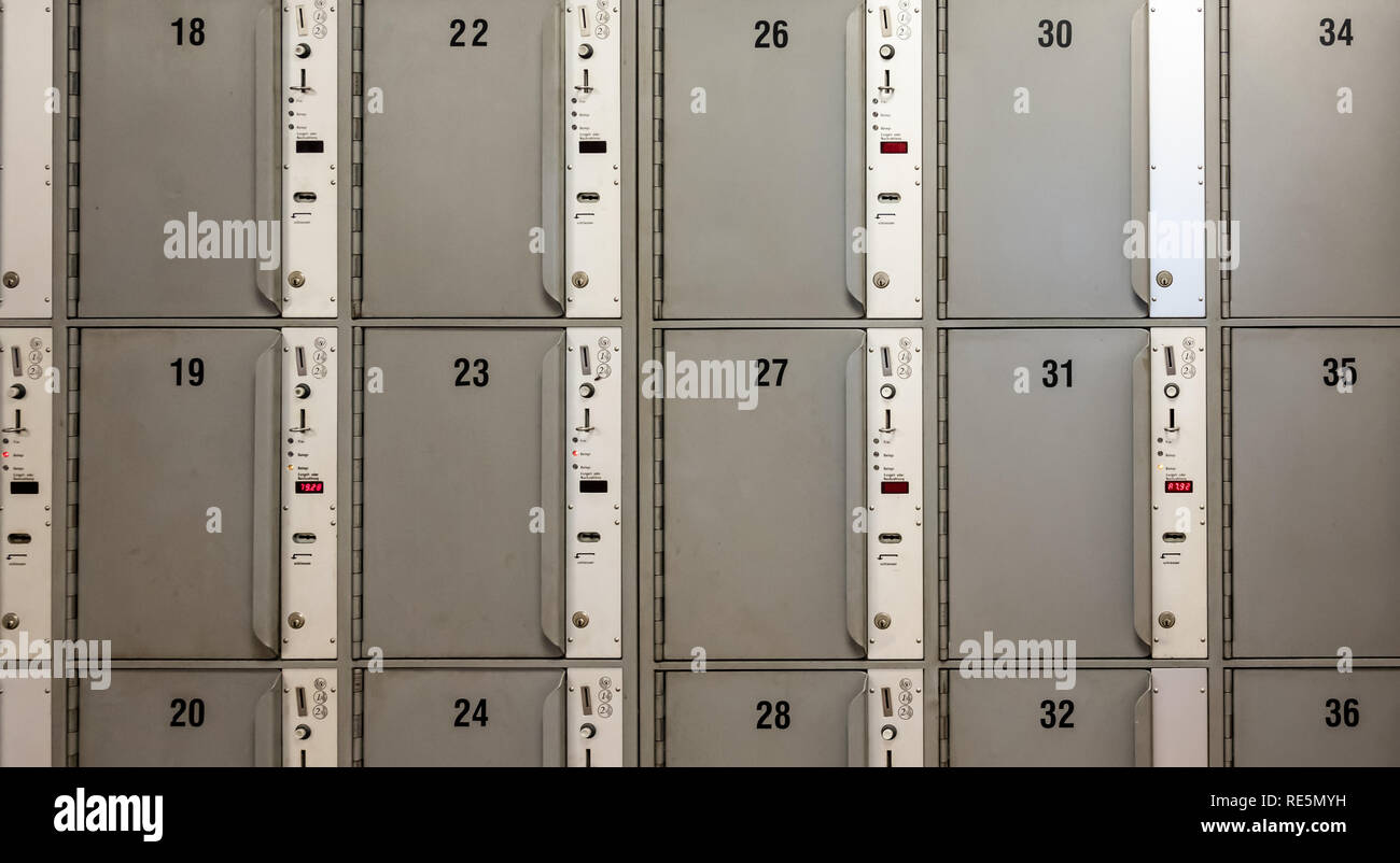 Desolate grey rows and columns with lockers, abstract photo Stock Photo