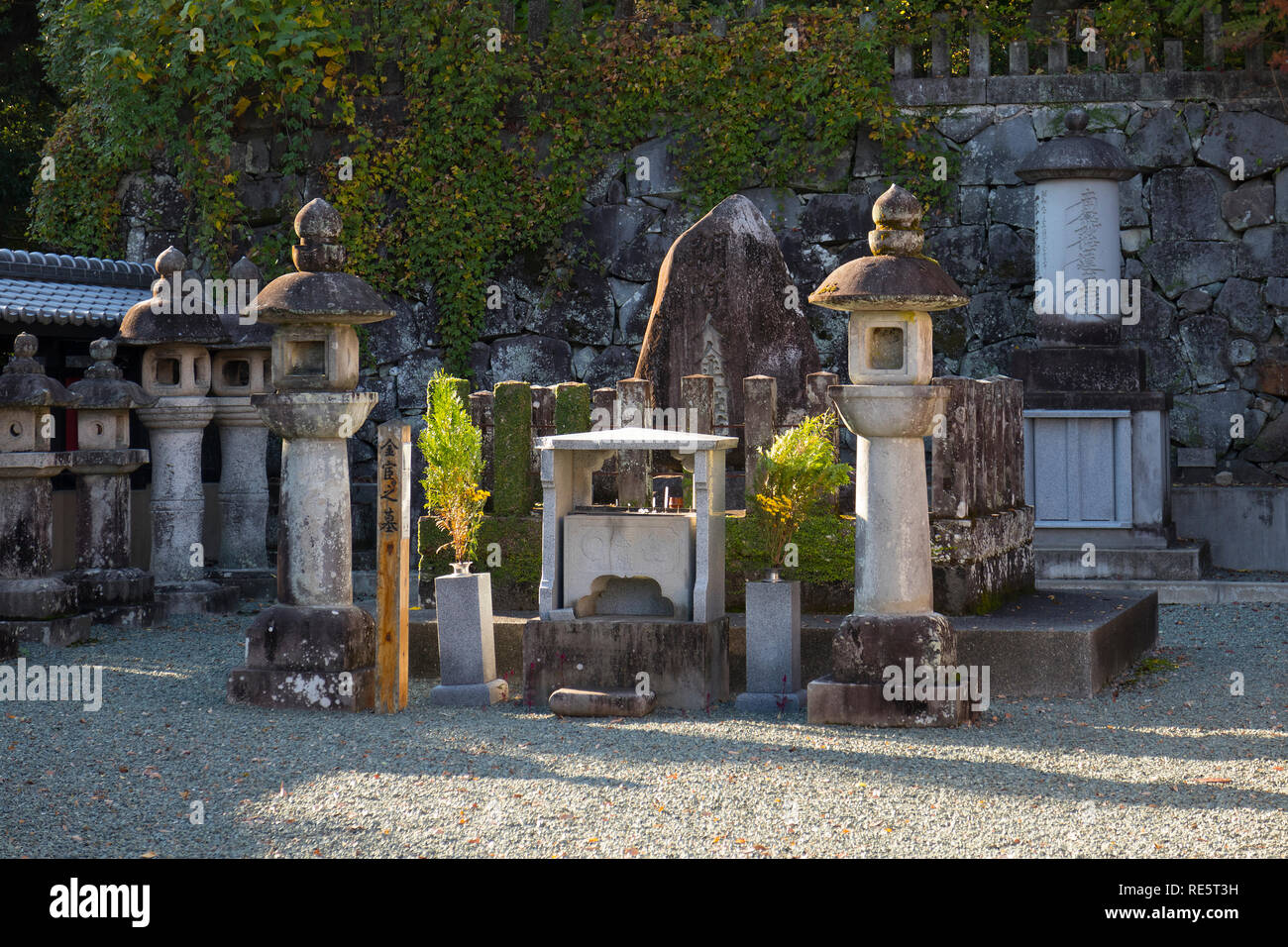 Kumamoto, Japan - November 13, 2018: Shrine and old stone lanterns on the grounds of the Honmyo-ji Temple Stock Photo