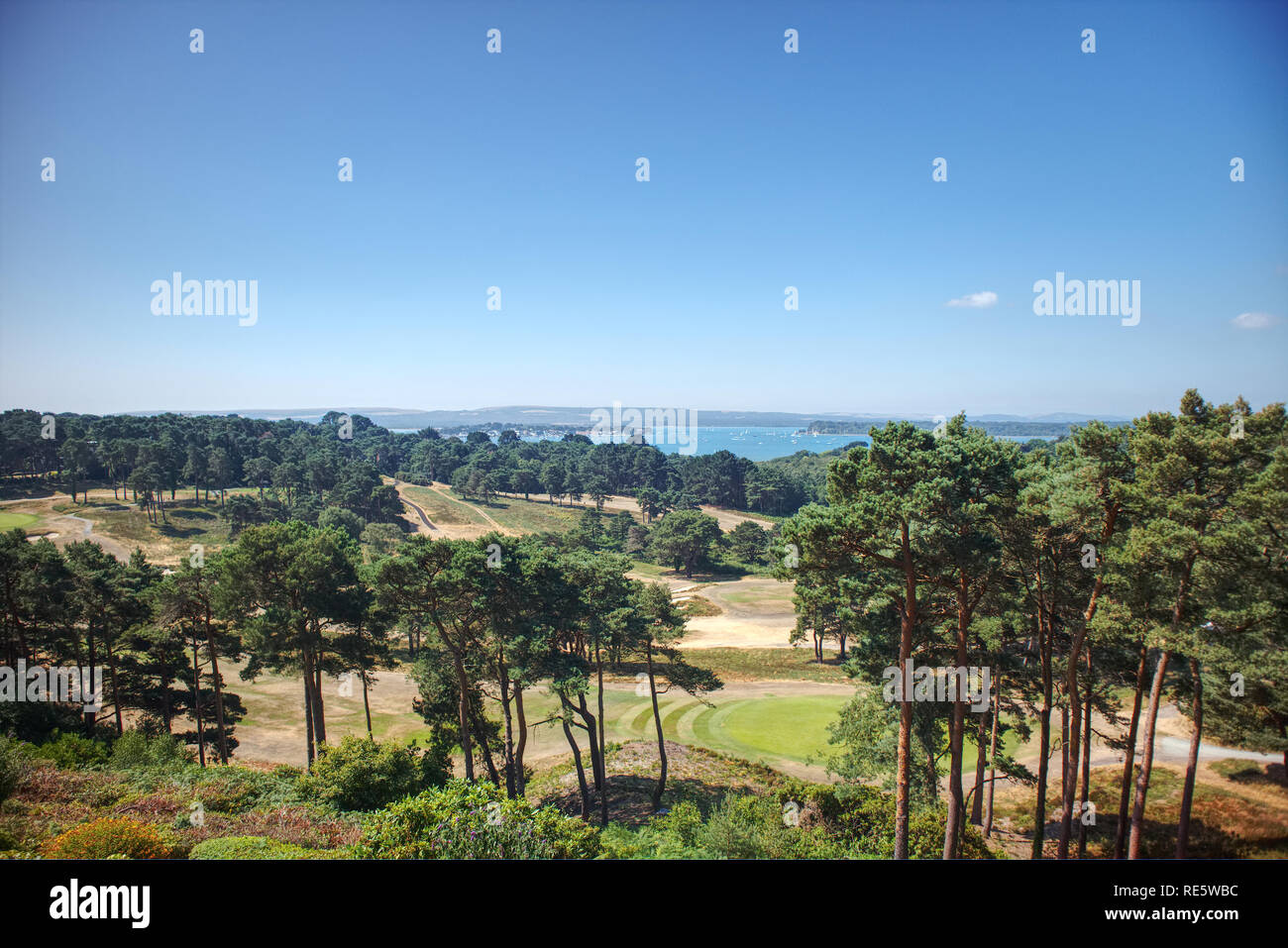 A panoramic view of Sandbanks, the Purbeck Hills, Brownsea Island and a golf course from Poole on the Dorset Coast in England, UK in the summer. Stock Photo