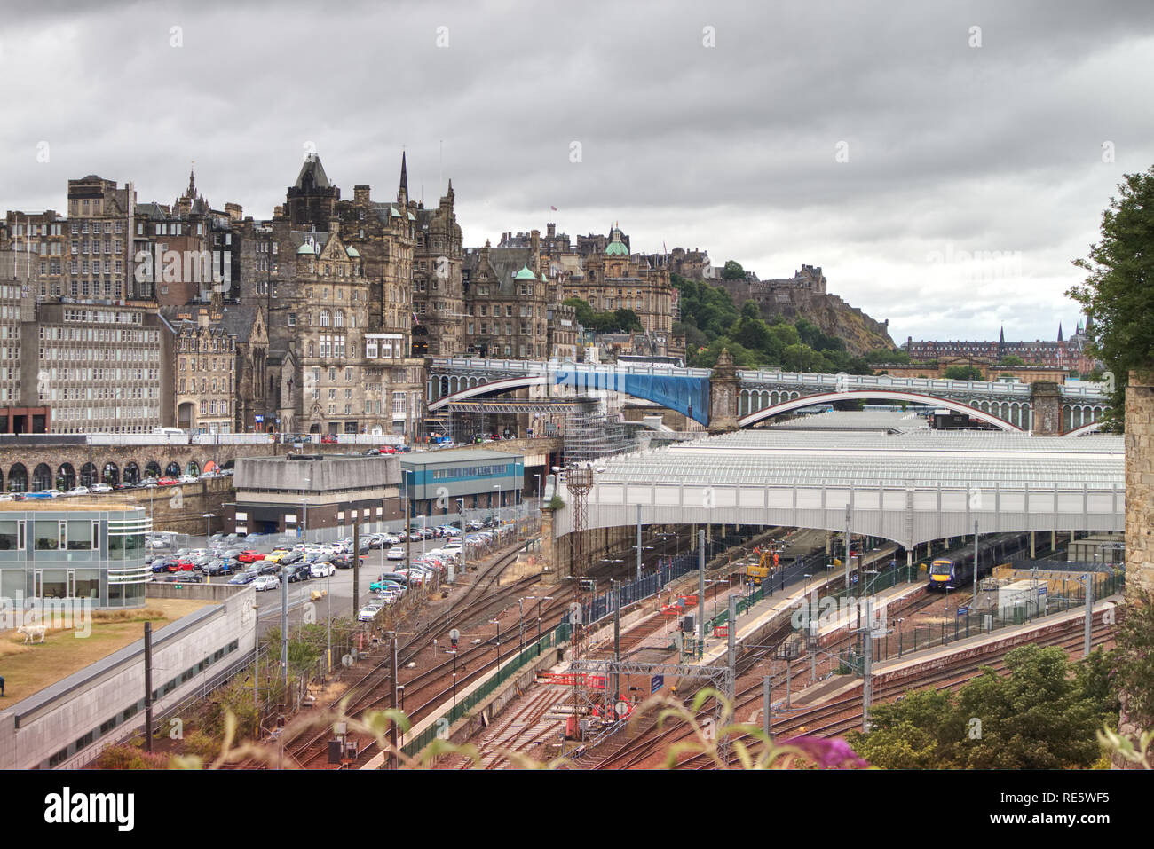 Edinburgh, Scotland / United Kingdom - July 29 2018: A Scotrail Turbostar train from the Borders is pulling in to Waverley Train station on an overcas Stock Photo