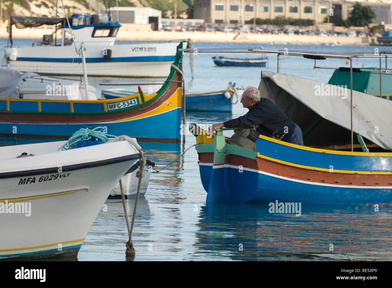 Marsaxlokk / Malta : November 30 2018: Fisherman are returning to Marsaxlokk harbour with their catch of fish Stock Photo