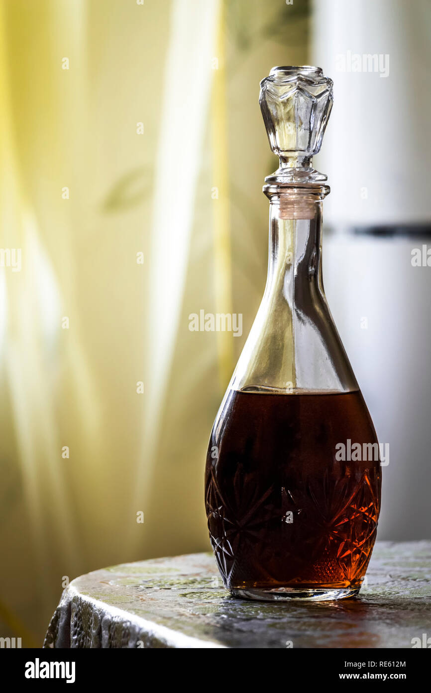 A decanter with brandy stands on the kitchen table Stock Photo Alamy