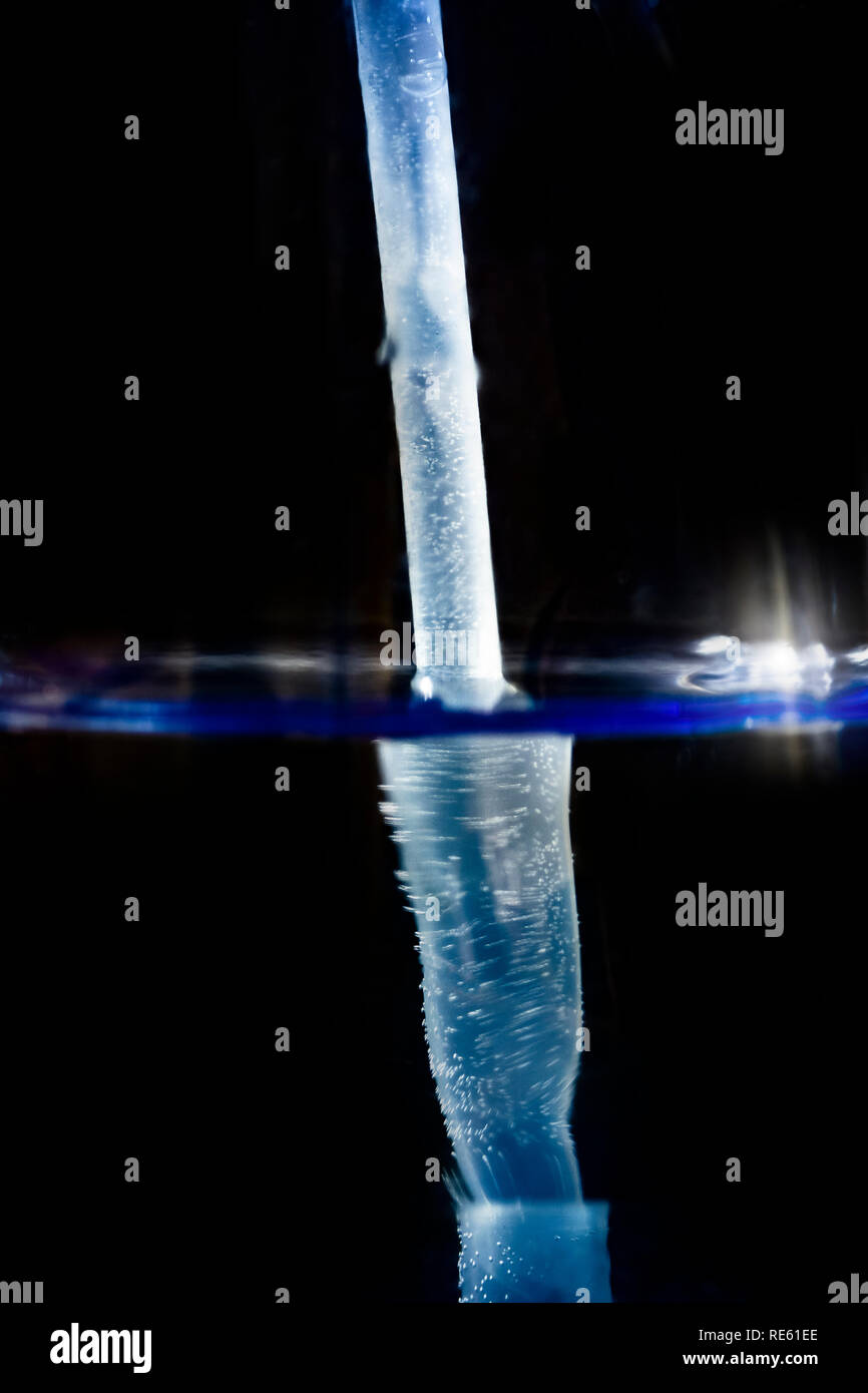 Plastic drinking tube in a glass of water Stock Photo Alamy