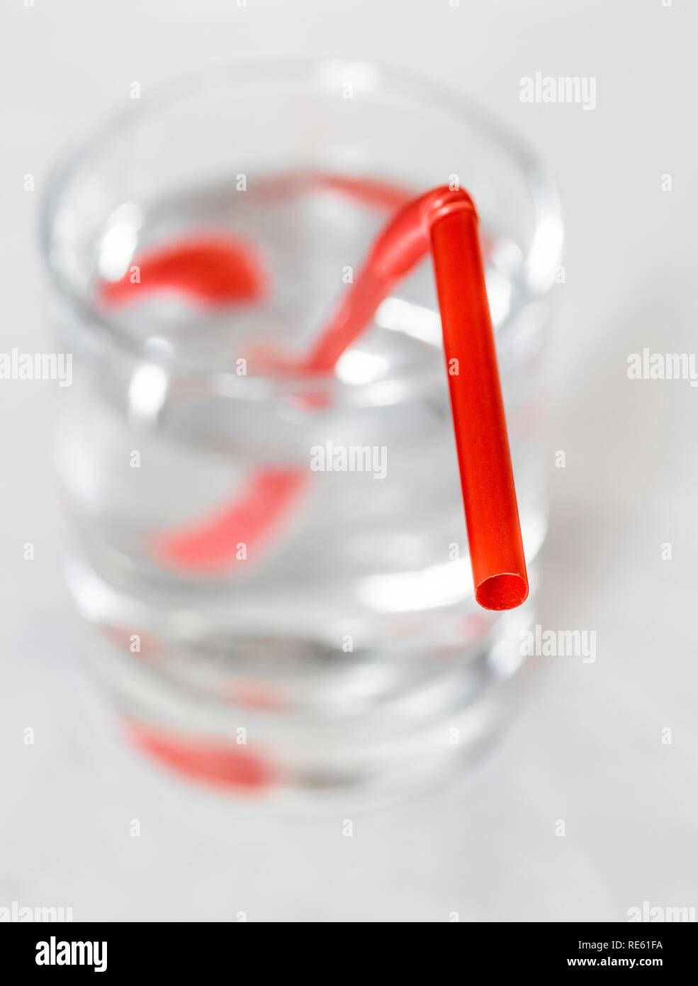 Plastic drinking tube in a glass of water Stock Photo Alamy